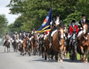 Standard Bearer Gary Williamson leading the calvalcade of horses round the boundaries